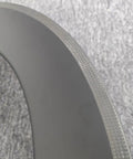 Close-up of black 700C Carbon Wheelset For Road Bikes With 65mm Aero Rim, T800 Carbon Fiber material detail on textured surface.