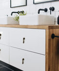 Slick Eight Piece Set Of Black Solid Brass Cabinet Knobs And Drop Style Pulls For Kitchen Drawers And Cupboards With Dang Tough Screw Mount Hardware That Brings Badass Retro Charm To Your Home on a modern white bathroom vanity.