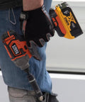 Worker holding impact driver with Impact Socket Set For One Half Inch Drive Metric 12 Point Deep Sockets Self Adjusting tool attached