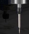 Carbide end mill router bit with 1/8-inch shank mounted in CNC spindle, upcut