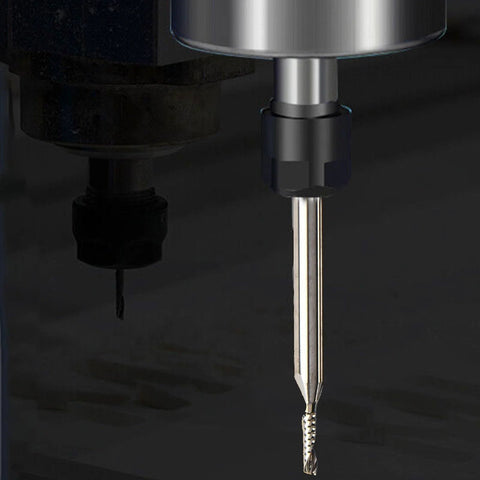 Carbide end mill router bit with 1/8-inch shank mounted in CNC spindle, upcut