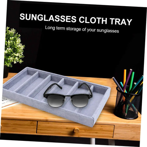 Straight Up Neat And Quick To Organize With This Six Grid Sunglasses Tray in grey fabric displaying sunglasses on a desk.