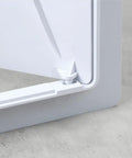 Close-up of No Hassle Drywall Access Panel, 14 X 29 Inch Abs Plastic Removable Wall Cover corner and locking mechanism.