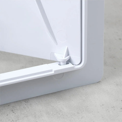 Close-up of No Hassle Drywall Access Panel, 14 X 29 Inch Abs Plastic Removable Wall Cover corner and locking mechanism.