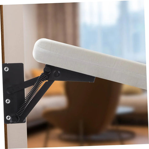 JECOMPRIS folding hinge lifting bracket, black metal with spring, installed on a cabinet door.