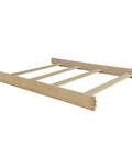 Crib To Full Bed Conversion Rails For Cove Collection Wooden Bed Rails In Natural Oak Finish with hooks and slats, angled view.