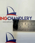 29mm Carbo T2 Block For Sailboat Rigging Black beside ruler on Sailing Chandlery background