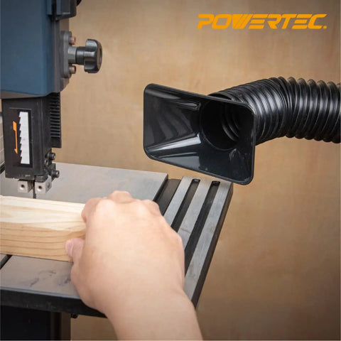 Flexible 2.5 Inch Dust Collection Hose With Left Spiral Design connected to a table saw capturing dust in a woodworking shop.