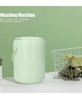 Compact 3L Portable Washing Machine With Quick Spin Cycle For Underwear Socks And Delicates Hassle Free On The Fly Laundry Tool Perfect For Dorms RVs Campers And Tiny Apartments Green beside a laundry basket.