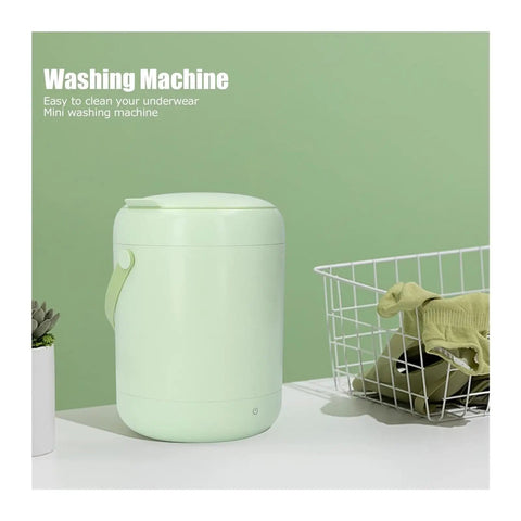 Compact 3L Portable Washing Machine With Quick Spin Cycle For Underwear Socks And Delicates Hassle Free On The Fly Laundry Tool Perfect For Dorms RVs Campers And Tiny Apartments Green beside a laundry basket.