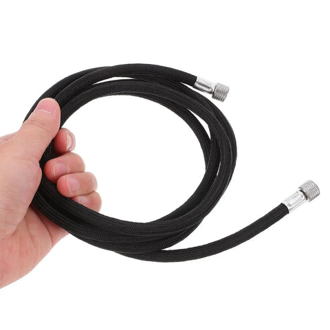 Hand holding Kickin Flexible Braided Airbrush Hose Replacer With 1/8 Connector For Mini Pump Interior Keeps Cleanup A Breeze For Artists Needing Zero Kinks During Precision Spraying While Keeping Airflow Steady So You Nail Job Without Blockages Or Leaks Today. black braided airbrush hose