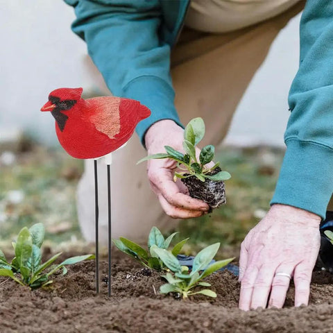 Simulated Bird Shaped Soil Moisture Sensor With Automatic Alarm Portable Plant Water Tester in garden bed with seedlings