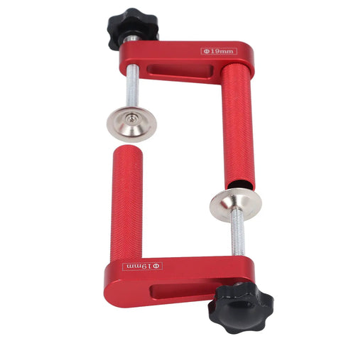 Two Pack Adjustable Bench Dog Clamp 19mm Aluminum Alloy Delivers 600lb Clamping Power, close-up of red metal bench clamp