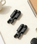One Pair Black Rubber Ear Clip Electrode For TENS 7000 And Most Standard Units on light background