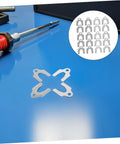 Pro Grade Universal Automotive Door Alignment Shims Kit For Heavy Duty Steel Panel Gap Measurement And Noise Reduction 144 Pieces, steel shims on blue workbench