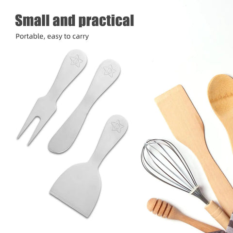 Five Piece Cheese Knives Set Stainless Steel Grab And Go Design with fork and spreader, next to wooden utensils.
