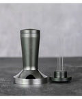 Pro Grade 58 Millimeter Espresso Tamper Plus Five Pin Coffee Distributor Needle Tool Two In One Ground Press Barista Kit on a stone surface.