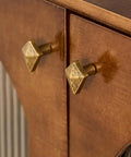 Antique Bronze Cabinet Knobs And Drawer Pulls Two Pack With Boho Geometric Silhouettes on wooden cupboard close-up.