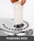 Heavy Duty 370W Electric Juice Extractor With Stainless Steel Body showing pushing rod being inserted into the juicer.