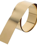 Thin Brass Sheet Roll And Brass Foil For DIY Jewelry Making And Craft Projects, rolled brass strip on white background