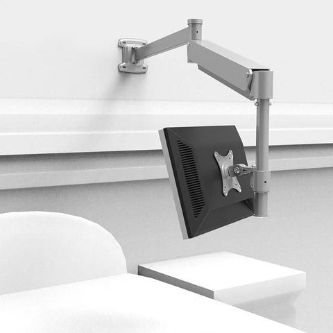 No Hassle Wall Mount Monitor Arm Straight Up Perfect For Your Gaming Office Setup Extra Long Gas Spring Mount in silver attached to wall with monitor tilted.