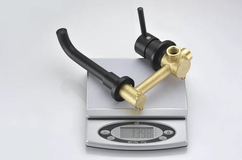 Wall Mount Bathroom Faucet Matte Black With RoughIn Valve Included Solid Brass Valve Body Corrosion And Tarnish Resistant Finish Vessel Sink Ready HighFlow Design Model S1385DI BuiltToLast Easy Install shown on weighing scale