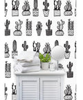 Heavy Hitter Commercial Wallpaper Featuring Bold Botanical Prints And Soft Linen Texture, Pvc Free Paste To Paper Wallcovering Built Different For High Traffic Spaces on a shelf with towels.