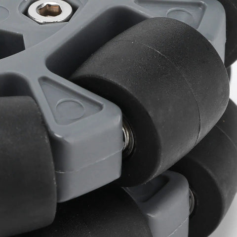 Close-up of 100mm nylon rubber omnidirectional wheels with double row bearings for RC cars and robotics, smooth 360 degree maneuverability