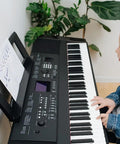 Child using Sheet Music Stand For Keyboard Players, Rock Solid, Durable And Adjustable, Clip And Height Easily Adjustable