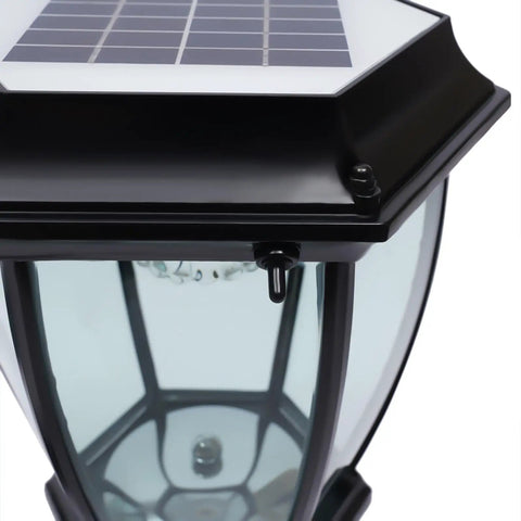 Close-up of the black Outdoor Solar Post Lights 2 Pack Waterproof LED Landscape Lanterns with solar panel on top.