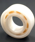 R188 full ceramic ball bearing with white housing and orange separators, 1/4in x 1/2in x 3/16in