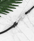 Heavy Duty Motorcycle Luggage Straps 4 Pack With Carabiners Elastic Tie Down Straps, black polyester rope with carabiner on tile background