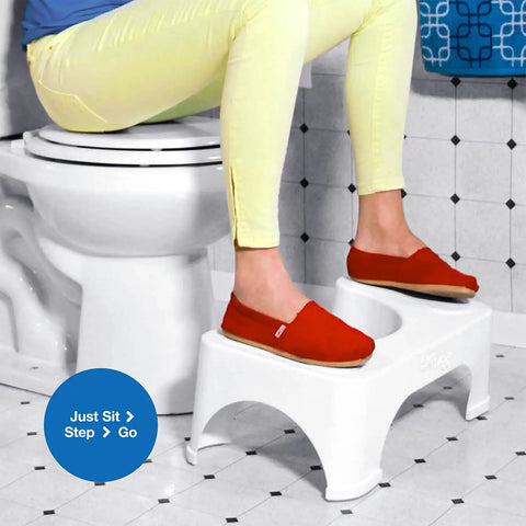 Person using 7 Inch Toilet Stool For Squatting To Make Pooping Easier, Helps Open Your Colon Naturally, Reduces Strain On Your Back And Pelvic Floor, Ergonomic Bathroom Accessory For A Smoother, More Complete Bowel Movement, Simple, Durable Design in bathroom, fits standard toilets, white plastic
