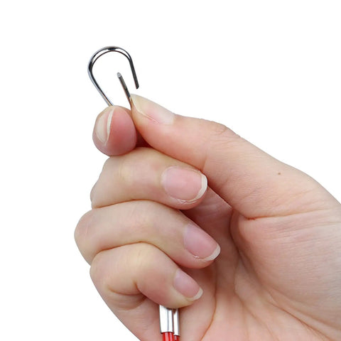 Hand holding metal hook of Beefed Up Boat Safety Kill Switch Lanyard Connector For Yamaha Suzuki Honda Tohatsu Hidea Outboards
