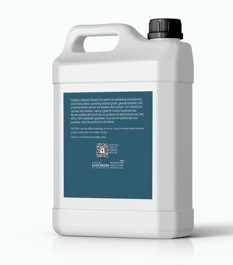 Backside view of 64 oz bottle labeled Mineral Oil For Wood Care 64 Fl Oz Pure And Undiluted Clear Formula No Additives Safe For Cutting Boards Butcher Blocks And Wooden Utensils Packaged In The USA