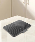 Legit Heavy Duty Silicone Countertop Drying Mat For Kitchen And Bar With Non Slip Grip And Quick Drainage keeps counters crisp on a marble surface.
