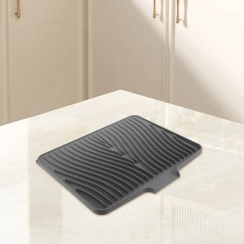 Legit Heavy Duty Silicone Countertop Drying Mat For Kitchen And Bar With Non Slip Grip And Quick Drainage keeps counters crisp on a marble surface.
