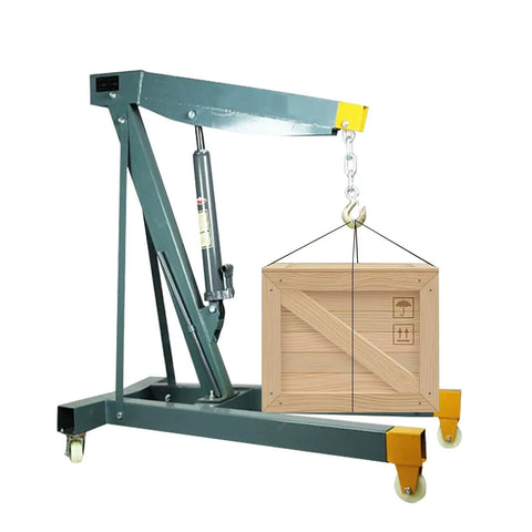 Heavy Duty Hydraulic Engine Hoist Folding Cherry Picker Shop Crane with wooden crate lifted, sturdy steel frame, adjustable to 2 tons.
