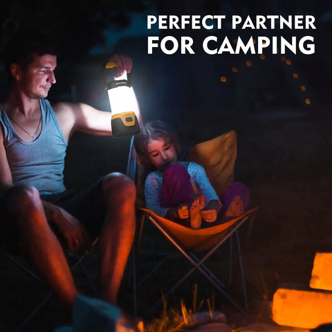 Rechargeable LED Camping Lantern with 1000 Lumens lighting a campsite with people relaxing by a fire.
