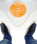 Urinal Screens Deodorizer Set Of 10 With Orange And Lavender Fresh Scents For High Traffic Bathrooms In Offices Malls And Restaurants Odor Control And Debris Blocking Commercial Air Freshener shown in a white urinal