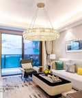 Curved Crystal Ceiling Pendant Light Ring LED Lamp Modern Home Decor Warm Glow Adjustable Wire Fixture in stylish living room.