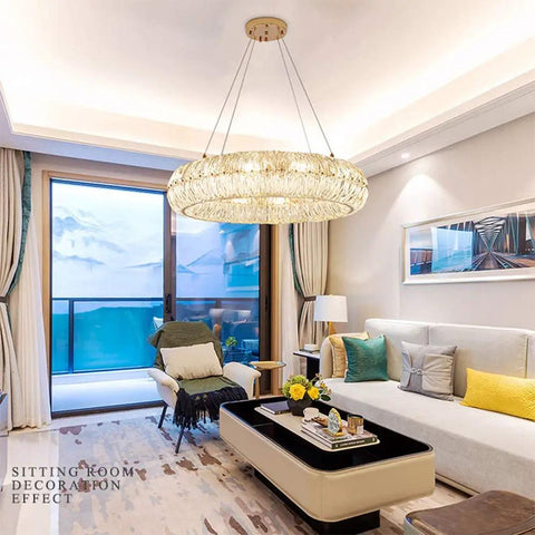 Curved Crystal Ceiling Pendant Light Ring LED Lamp Modern Home Decor Warm Glow Adjustable Wire Fixture in stylish living room.