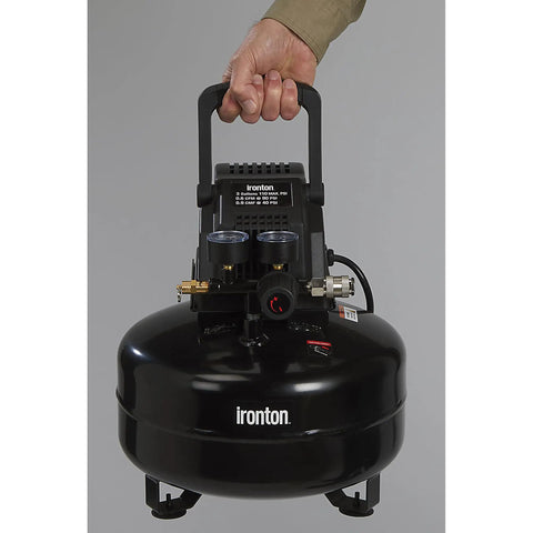 Portable 3 Gallon Air Compressor 0.3 HP 110 PSI Max Pressure Oil Free Pump held with a fold down handle.
