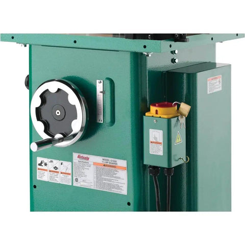 Built Like A Tank One Point Five Horsepower Woodworking Shaper Featuring Massive Twenty By Eighteen Inch Cast Iron Table and dual voltage motor controls.