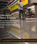 Real Deal Universal Surface Finish For Wood Leather Plastic Vinyl And Metal That Is Straight Up Waterproof And Food Safe While Acting As A Hella Solid Solvent Free Non Toxic Protection Layer Inside A Handy Four Ounce Jar For Instant Glow Ups applied to a polished concrete floor by a worker.
