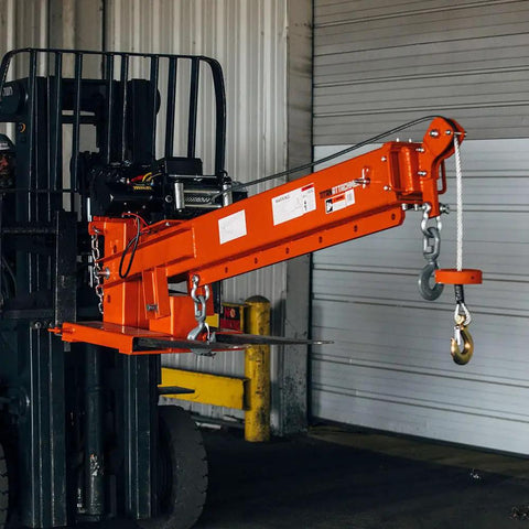 Heavy Duty Fork Mounted Jib Crane With Electric Winch Pivoting Telescopic Boom Extends To 138 Inches Wireless Remote shown on forklift.