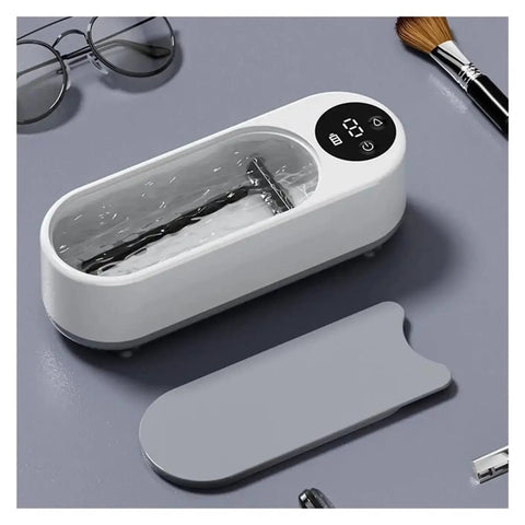 This Slick Little Ultrasonic Cleaner Machine Packs A Serious Punch With A Roomy 300 ML Tank for cleaning jewelry and gadgets.