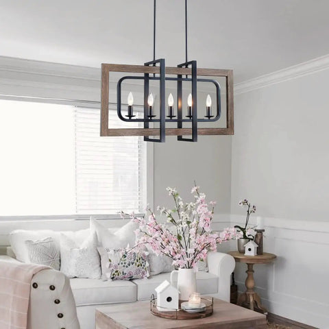 Farmhouse Chandelier Light Fixture With Five Lights In Antique Bronze Oaky Painted Finish hanging in a cozy living room