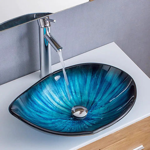 Modern Oval Glass Vessel Sink With Blue Line Stripes, Slick Countertop Washbasin Built On Badass Toughened Glass with water stream.