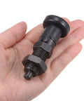 M16x1.5 Push Fit Ball Nose Spring Plunger With 8mm Pin And 1.02 Inch Thread held in hand, showcasing solid carbon steel finish.